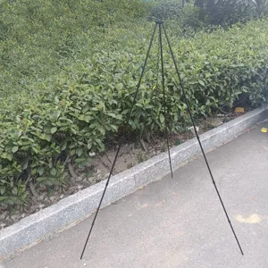 Outdoor camping iron tripod for hanging cooking pots, portable campfire grill stand for hiking.