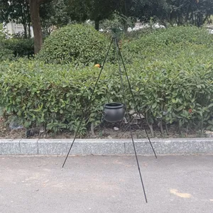 Portable outdoor tripod stand with hanging pot, ideal for Halloween camping and bonfire parties.