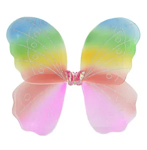 Detailed view of colorful rainbow fairy butterfly wings with glitter mesh and central butterfly.