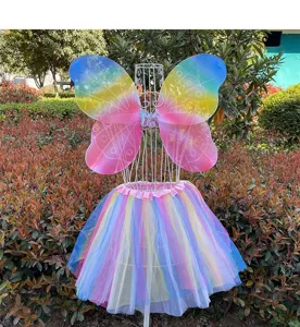 Detailed outdoor view of rainbow butterfly fairy wings and fluffy mesh tutu skirt set.