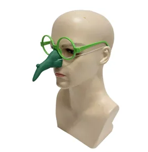 Detail view of funny Halloween witch green round glasses with long nose prop party accessory.