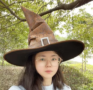 Halloween witch hat detail, brown textured costume wizard cap with sparkling rhinestone buckle.