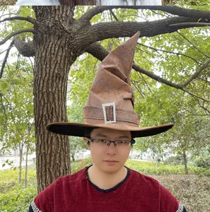 Detail view of the brown pointy wizard hat featuring crinkled texture and rhinestone buckle.
