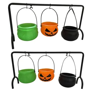 Halloween hanging witch cauldrons set with black metal rack, pumpkin candy buckets for party decor.