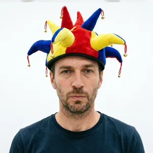 Colorful jester hat with bells for Halloween party, funny costume costume accessory for adults.