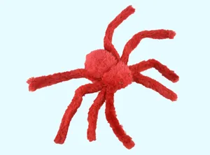 Close-up view of a red plush spider toy detail, soft fluffy material with long legs for Halloween.