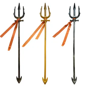 Detailed view of three metallic trident props featuring textured shafts and orange ribbons.