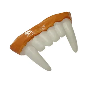 Close-up detail of Halloween vampire fangs, realistic white teeth with orange gum design.