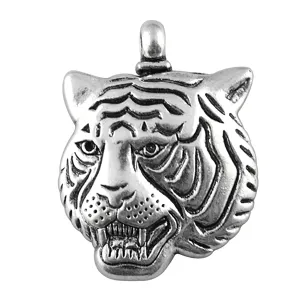 Detailed view of vintage silver tiger head pendant, perfect metal DIY jewelry accessory.