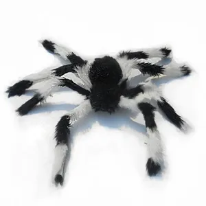 Detailed close-up of the black and white plush Halloween spider toy texture and fluffy legs.