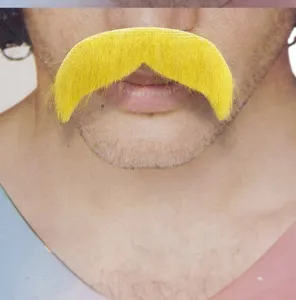 Close-up detail of yellow fake mustache, self-adhesive costume prop for Halloween party.