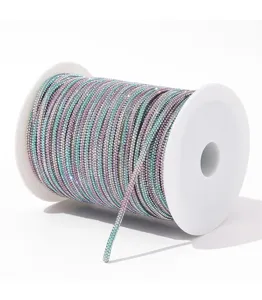 Detailed view of colorful rhinestone cord roll, sparkling crystal chain trim for DIY craft.