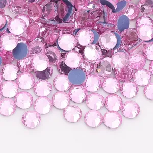 Detail view of sparkling pink flatback glass rhinestones, perfect for DIY crafts and nail art.