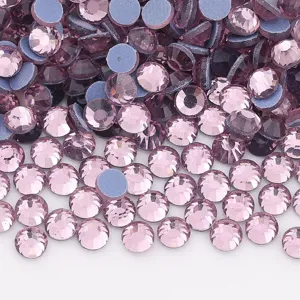Close-up detail of light purple flatback rhinestones crystals for DIY nail art and clothing decor.