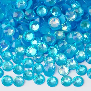 Close up view of bright blue flatback rhinestones, sparkling glass crystal craft diamonds.