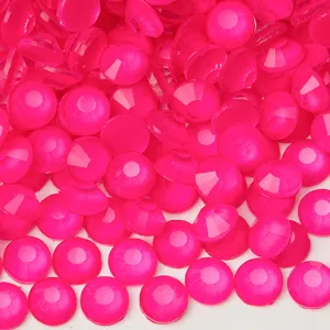 Close-up view of vibrant hot pink flatback rhinestones, perfect for nail art and DIY decor.