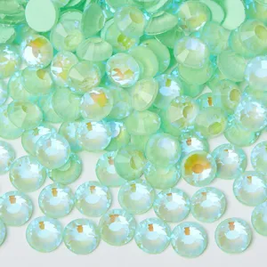 Close-up detail of light green AB flatback crystal rhinestones for DIY crafts and nail art.