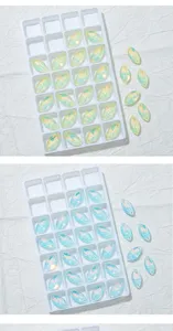 Close-up van AB-kleur markies kristal kralen in witte opbergtrays voor doe-het-zelvers.