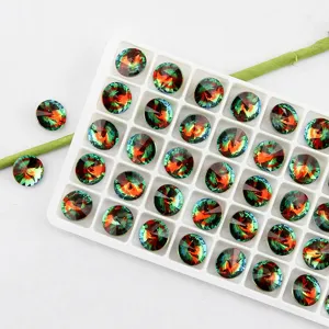 Close-up detail of 10mm round gradient crystal rhinestones in white storage tray for DIY.