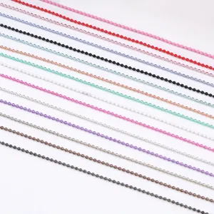 Close up of colorful fine bead chains, perfect for nail art DIY and crafts decoration.