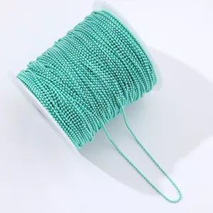 Detailed shot of a turquoise ball chain roll, perfect for DIY crafts and nail art decoration.