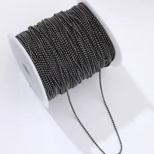 Dark metallic ball chain on white spool, ideal for DIY crafts, nail art decoration and jewelry.