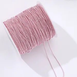 Closeup detail of the pink metallic bead chain roll, perfect for nail art and DIY jewelry crafts.