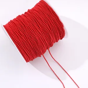Close up of vibrant red bead chain spool, detailed view of fine electrophoretic craft beads.