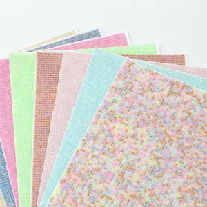 Close-up detail of colorful resin rhinestone sticker sheets, perfect for DIY craft decoration.