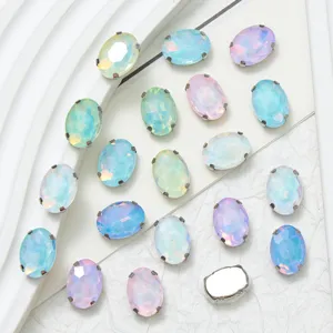 Oval glass sew-on rhinestones with claw settings, perfect for DIY clothing accessories and crafts.