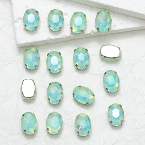 Oval glass rhinestones with claw settings, perfect for DIY garment sewing and craft decor.