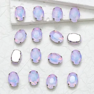 Oval glass rhinestones detail with claw settings, ideal for DIY fashion accessories.