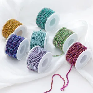 Colorful gradient glass rhinestone claw chains on spools for DIY phone cases and crafts.