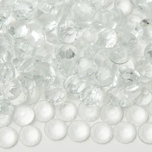 White glass flatback rhinestones close up, perfect for nail art and DIY phone case decor.