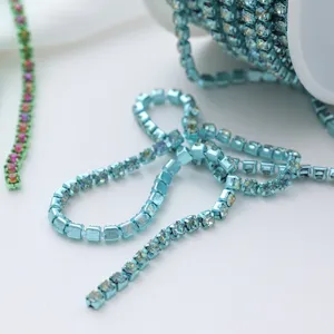 Close-up detail view of sparkling blue crystal rhinestone cup chain for DIY crafts and accessories.