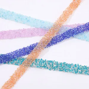 Detailed view of colorful self-adhesive resin rhinestone ribbons for DIY crafts and apparel.