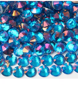 Detailed close up shot of sparkling blue phantom glass flatback rhinestones for DIY crafts.