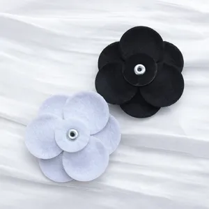 Handmade fabric flower accessories, black and white DIY shoe clips and hair clip decorations.