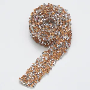 Close-up detail of sparkling resin rhinestone adhesive ribbon roll for DIY crafts and decor.