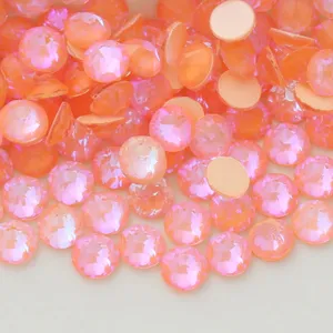 Close-up detail of sparkling fluorescent pink flatback rhinestones for nail art and DIY crafts.