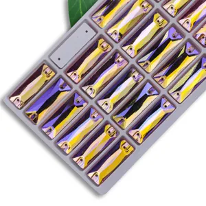 Detailed view of rectangular sew-on glass crystal rhinestones with dual holes and AB rainbow.