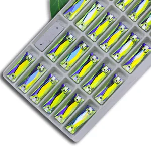 Close-up detail of rectangular AB color sew-on glass crystals with double holes for DIY crafts.