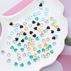 Heart-shaped crystal rhinestones flatback gems for nail art, DIY crafts and garment decoration.