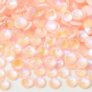 Close-up detail of pink AB flatback crystal rhinestones, sparkling for DIY nail art and crafts.