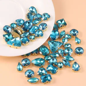Blue crystal glass rhinestones with gold settings, mixed shapes for DIY crafts and garments.