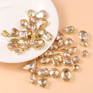 Crystal glass rhinestones detail featuring mixed shapes with gold claw settings for crafts.