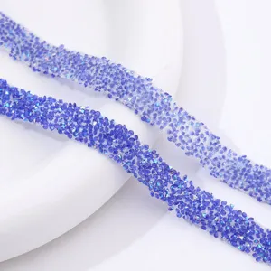 Close-up detail of blue rhinestone adhesive trim for DIY crafts, shoes, and clothing decoration.