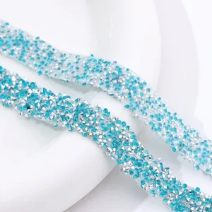 Close-up of blue and silver resin rhinestone crystal trim strip for handmade DIY crafts.