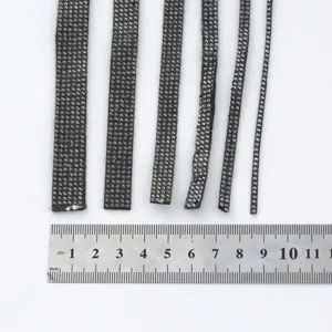 Detail view of black rhinestone hotfix tape strips in multiple widths with metal ruler.
