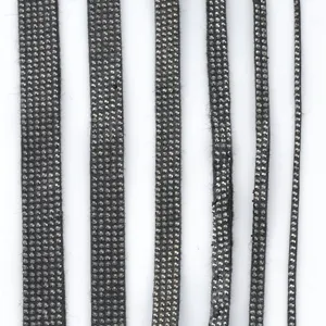 Black rhinestone trim detail showcasing sparkling crystal hotfix tape for DIY crafts and clothing.